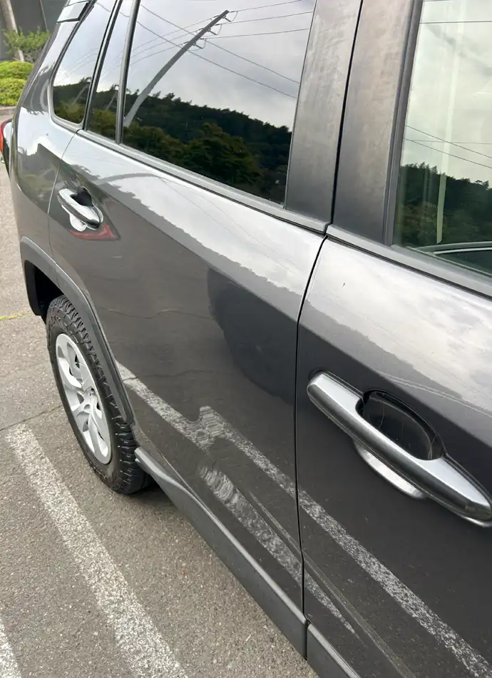 After paintless door ding removal